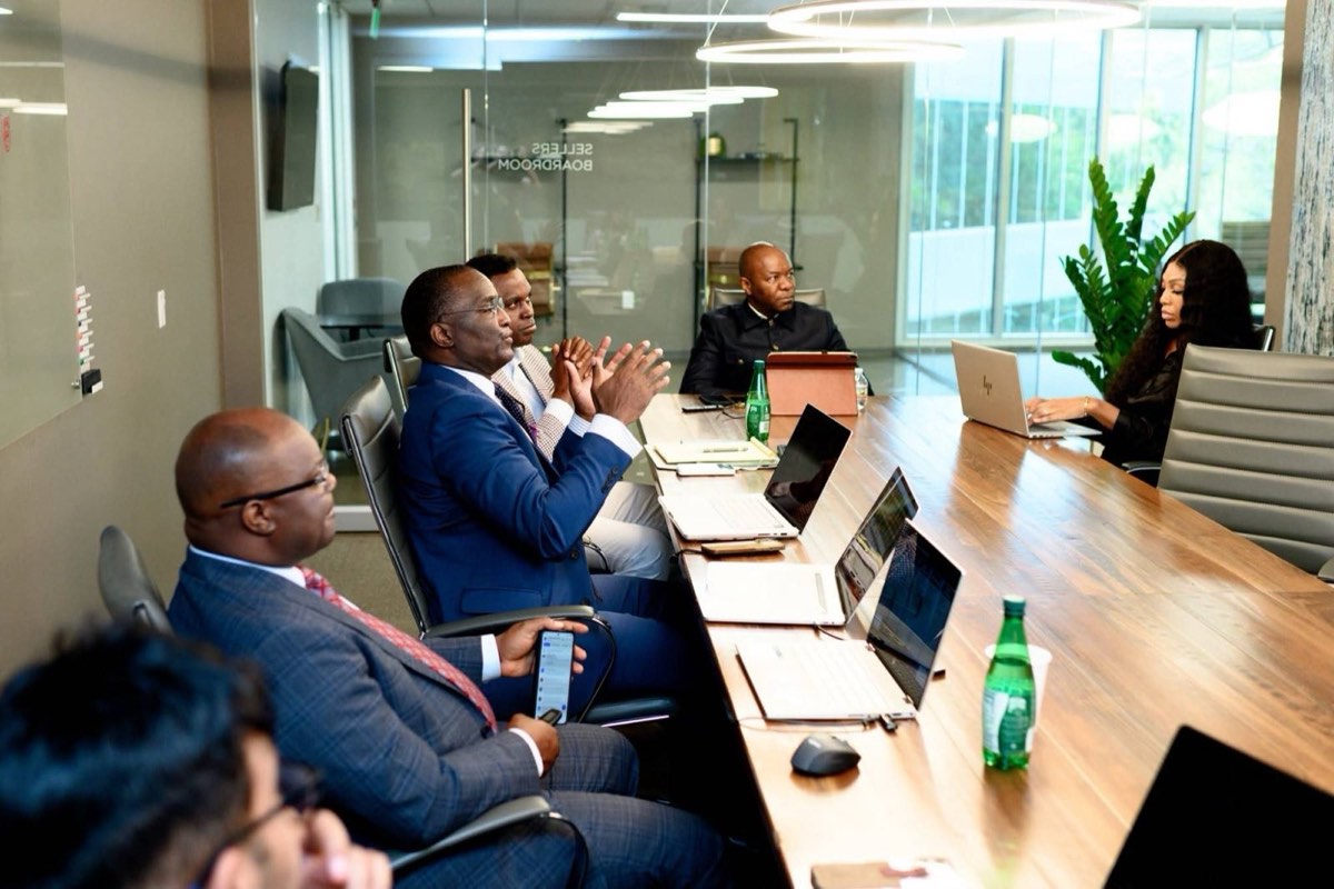 Kachikwu & Nama attorneys meeting with clients around a boardroom table